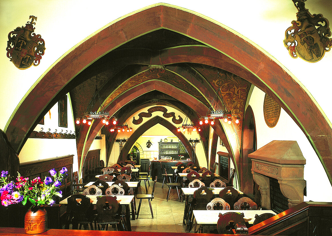 The Gothic-vaulted dark-wood dining room of Schlenkerla, Bamberg's 1405 Rauchbier tavern.