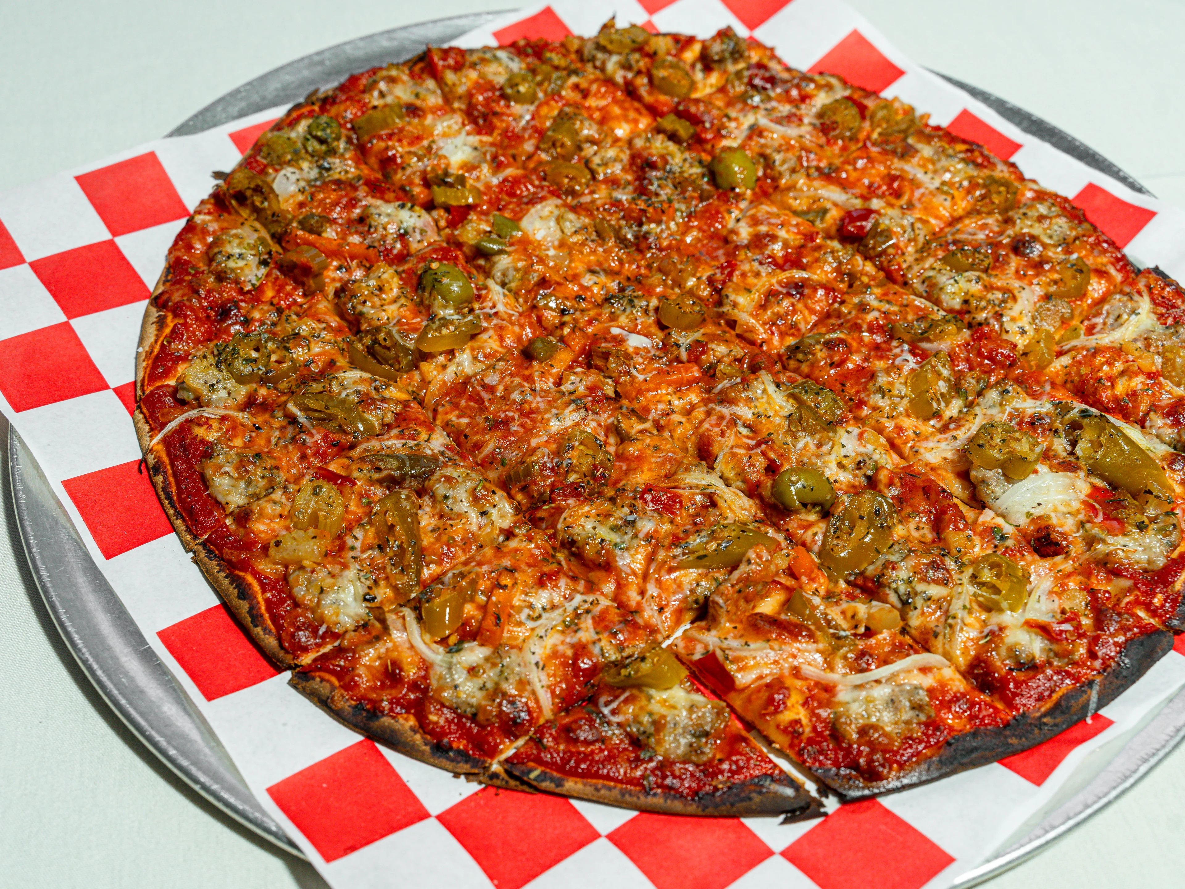 Sausage, giardiniera, and onion tavern-style pizza at Pizz'Amici, Chicago