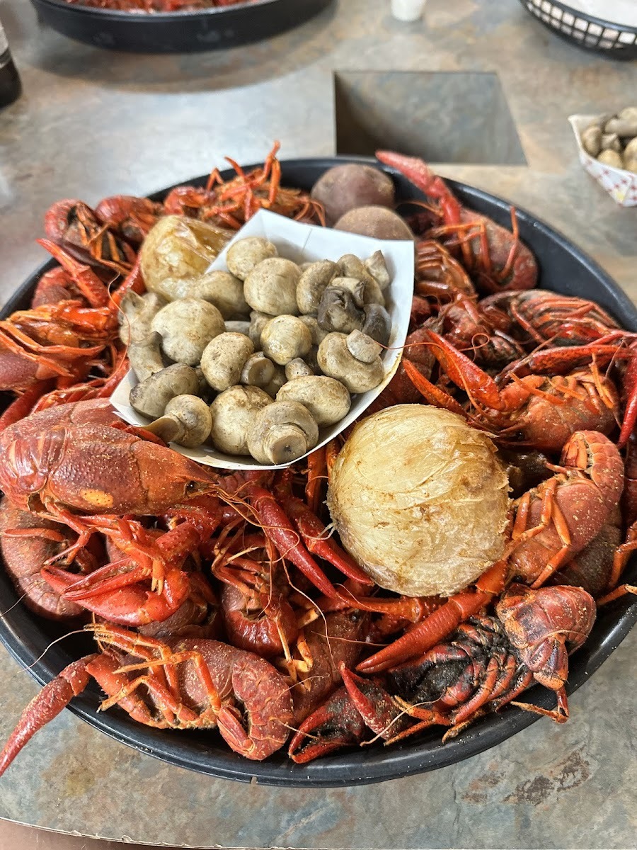 A platter of boiled crawfish with corn, mushrooms, and potatoes at Dwight's
