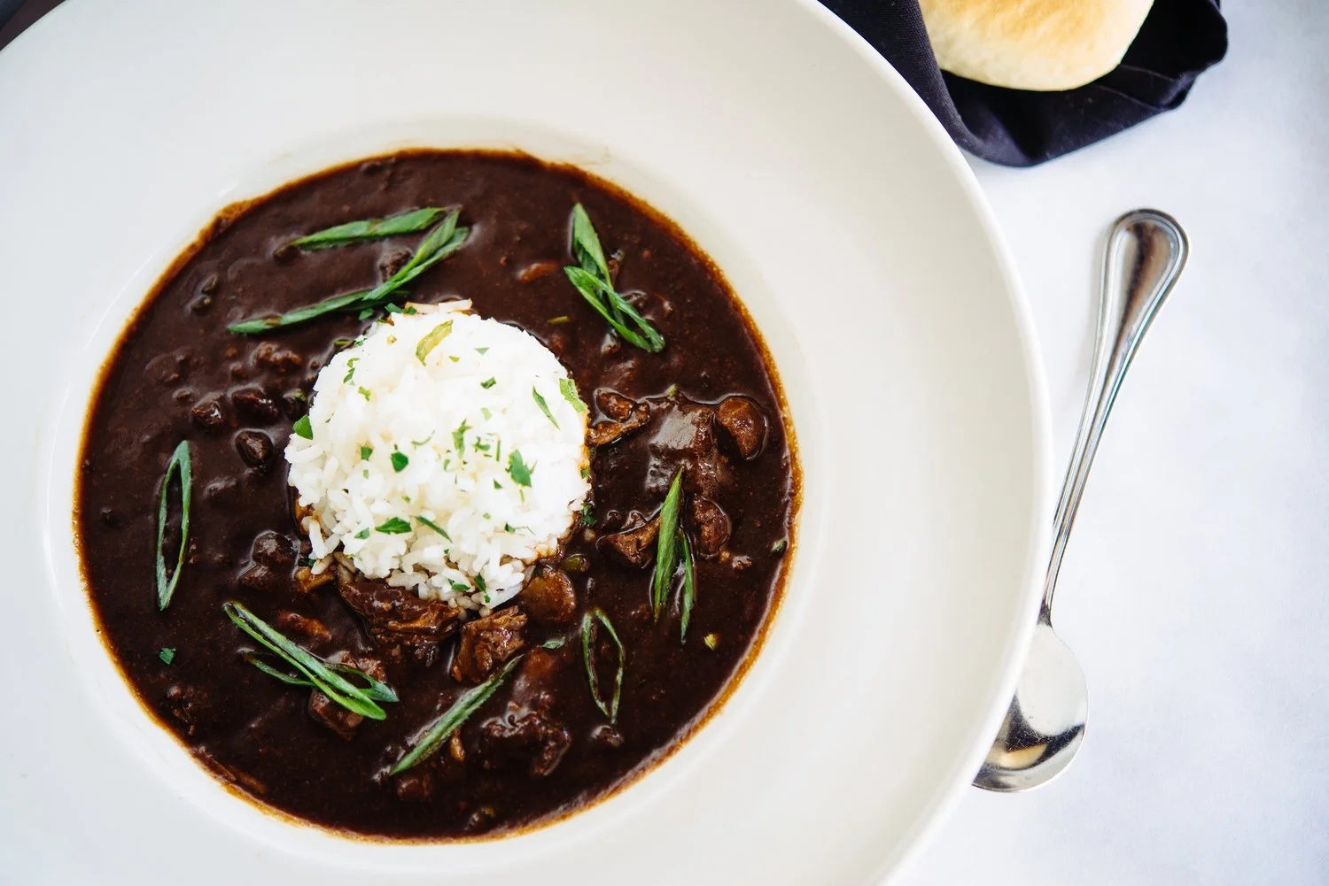 Charley G's smoked duck-and-andouille gumbo, dark roux with a dome of rice