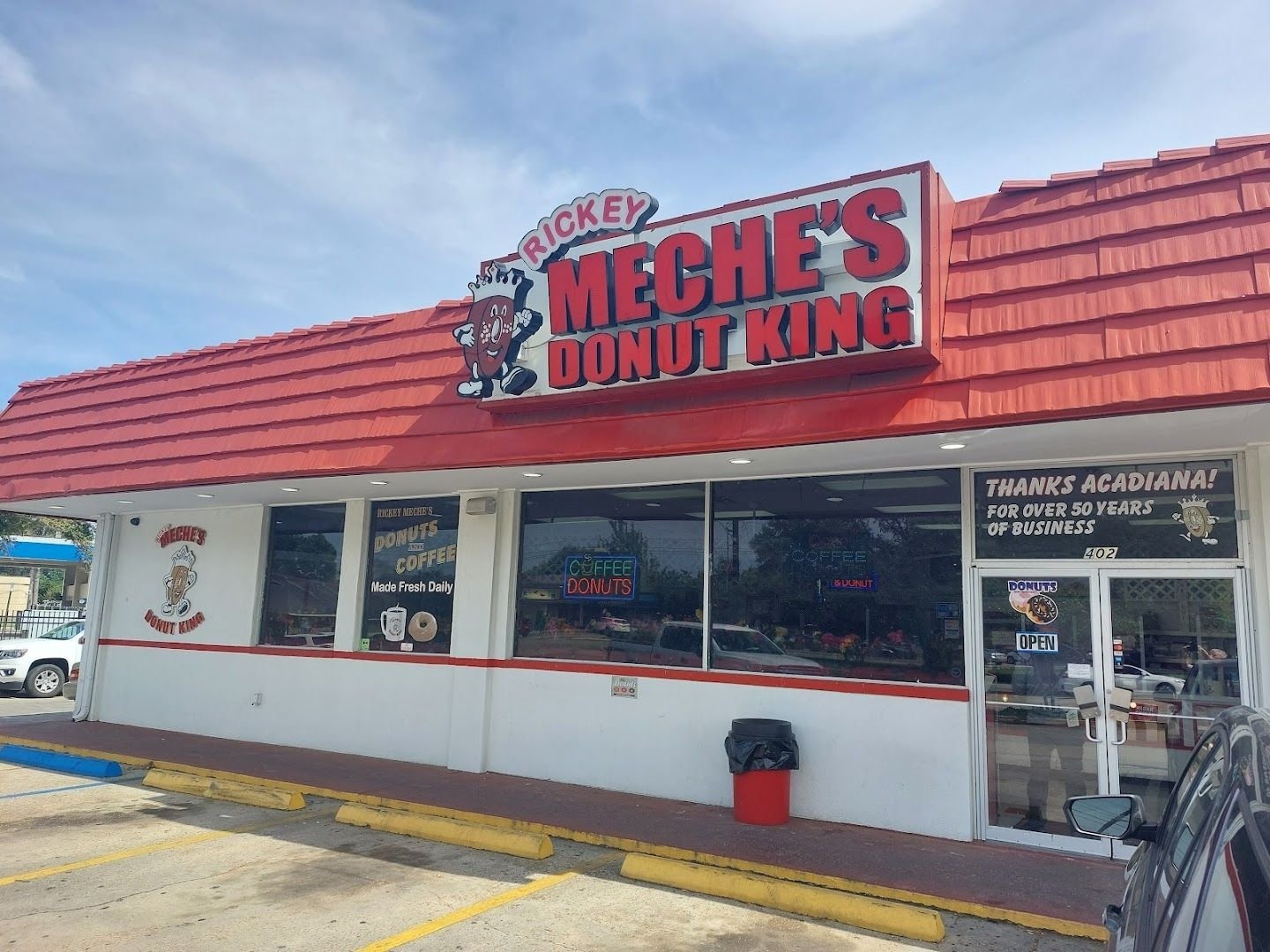 The red-roofed storefront of Rickey Meche's Donut King