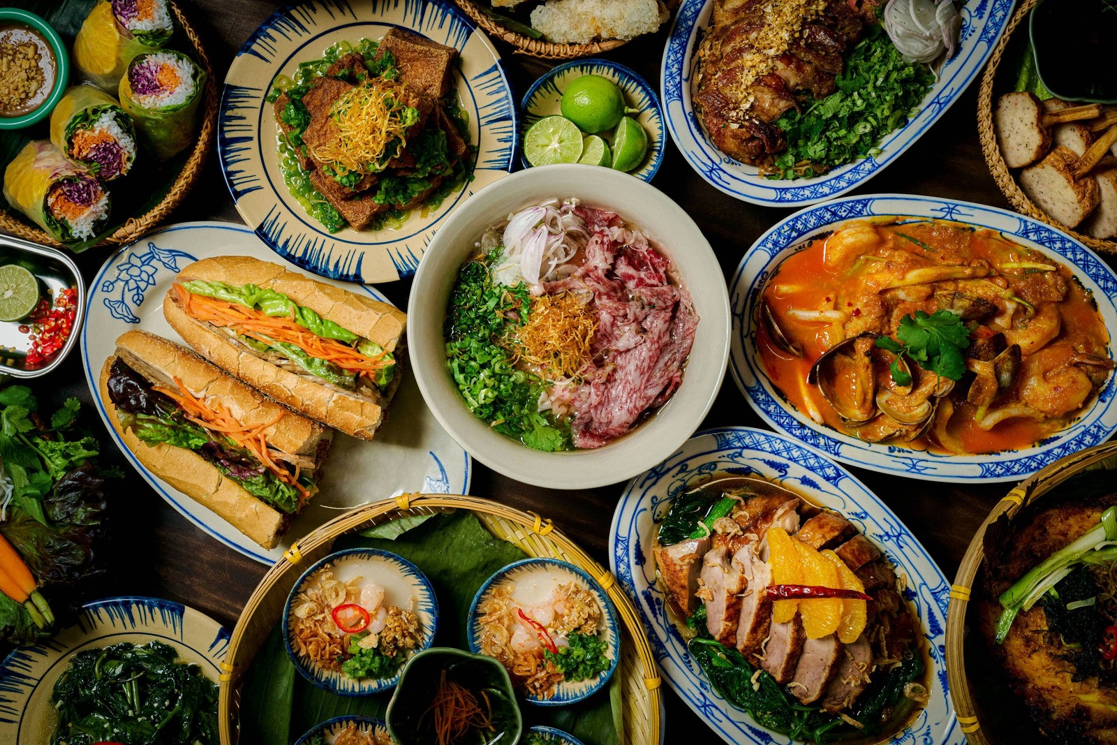 The wagyu pho at La Dong, its marbled beef front and center, surrounded by banh mi, summer rolls, and the rest of the spread