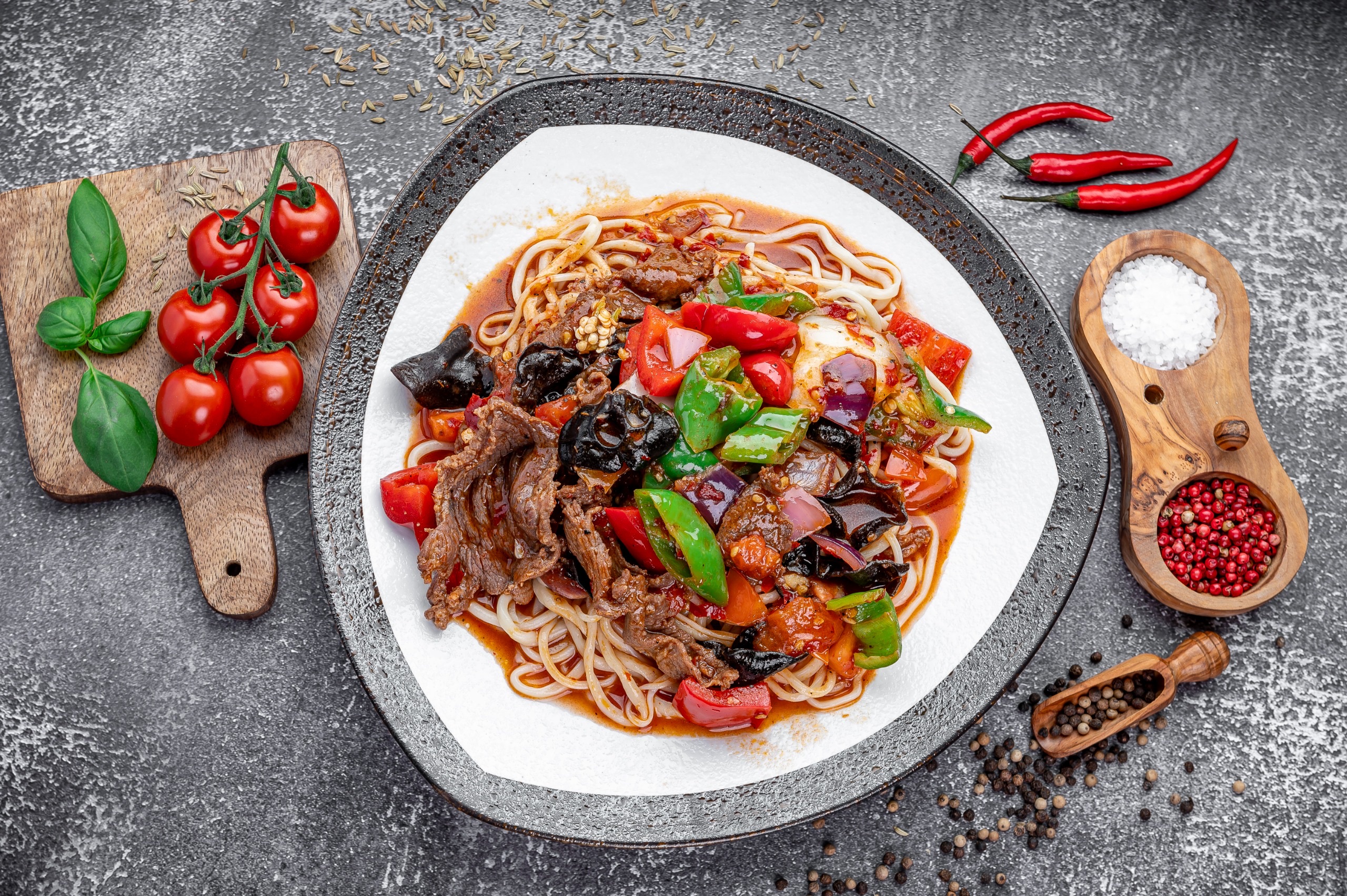 Guyurou Laghman, hand-pulled noodles with lamb, peppers, and wood ear mushrooms