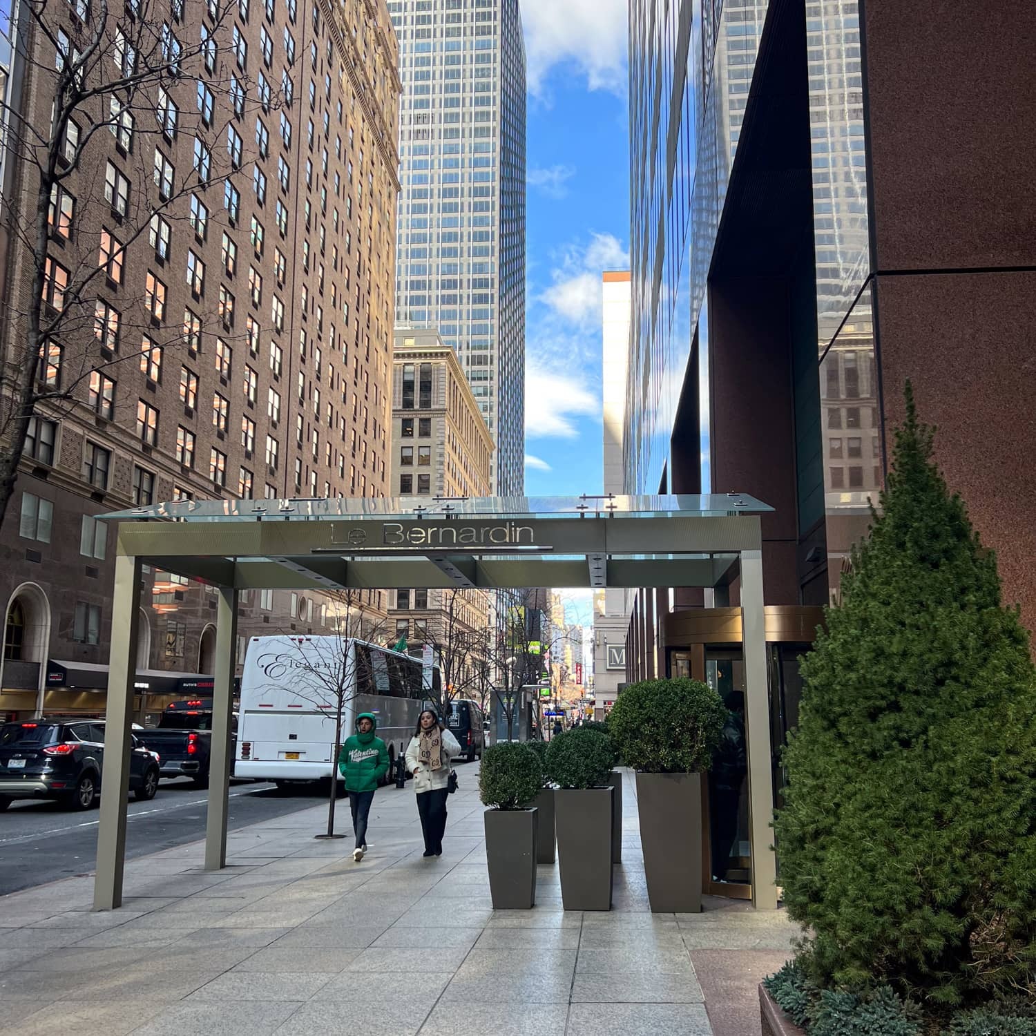 Le Bernardin entrance on W 51st St: glass canopy with the name etched on the beam