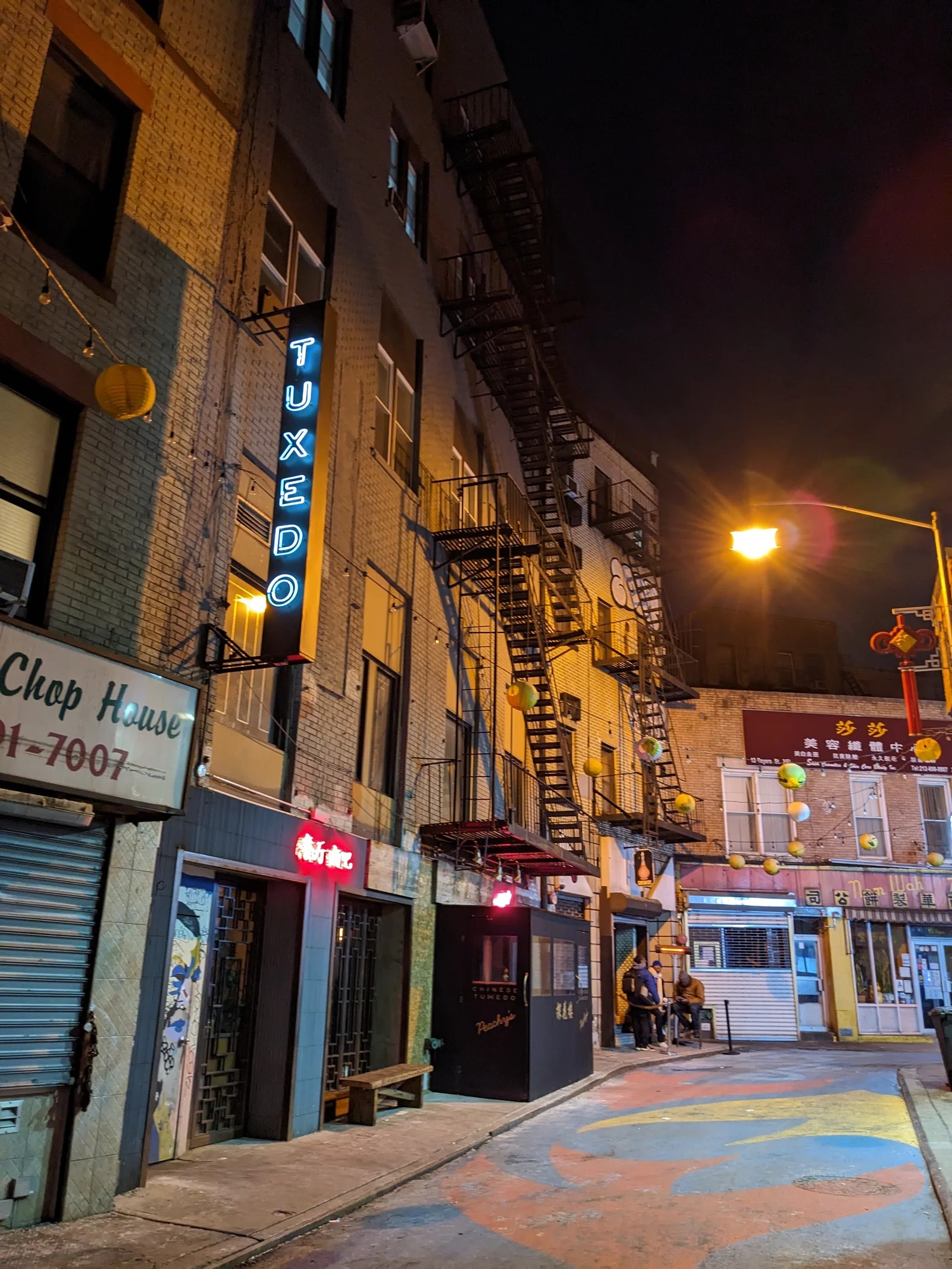 Chinese Tuxedo, the blue TUXEDO neon sign and entrance on Doyers Street at night