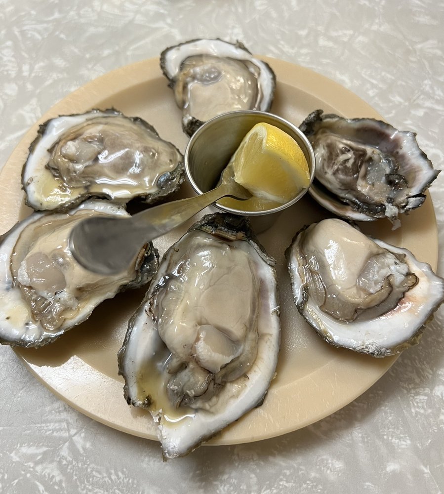 A half dozen raw oysters on the half shell with lemon at Casamento's.