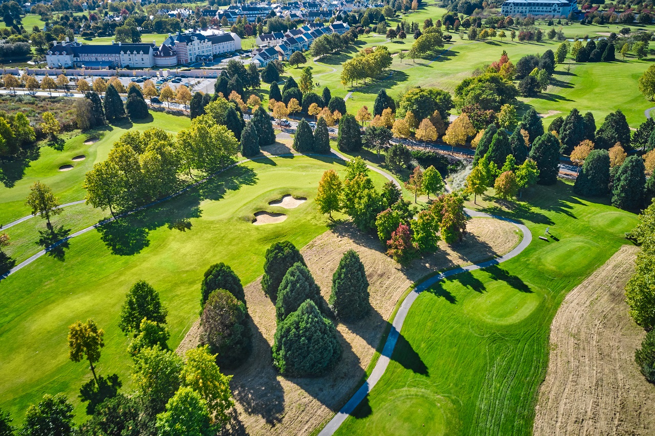 Aerial view of Golf Paris Val d'Europe, fairways and bunkers in the foreground