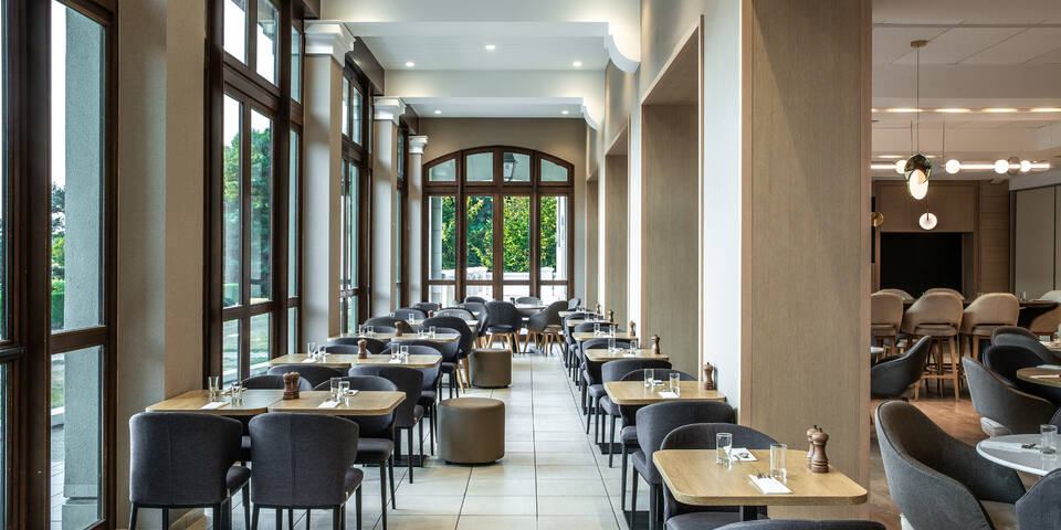 One of the hotel's three dining rooms, a bright modern restaurant interior