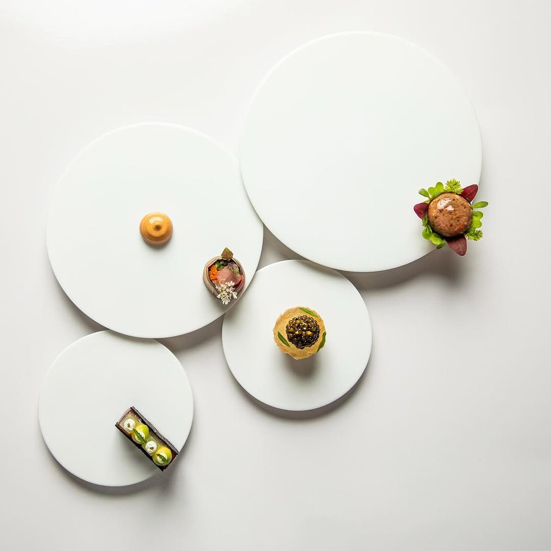 Emeril's canapés: tuna sandwich, daube glacé, pork spring roll with peanut sauce, and crab and caviar crustade.