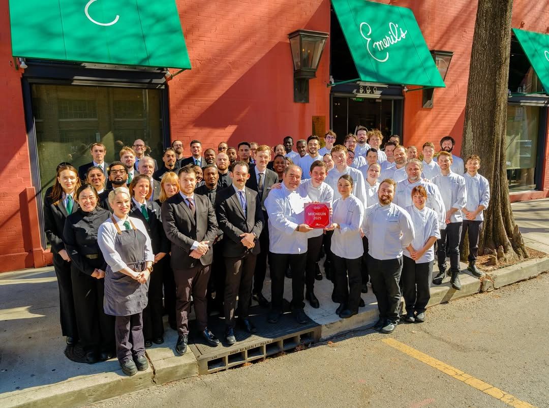 E.J. Lagasse with the Michelin plaque and the Emeril's brigade on Michelin day.