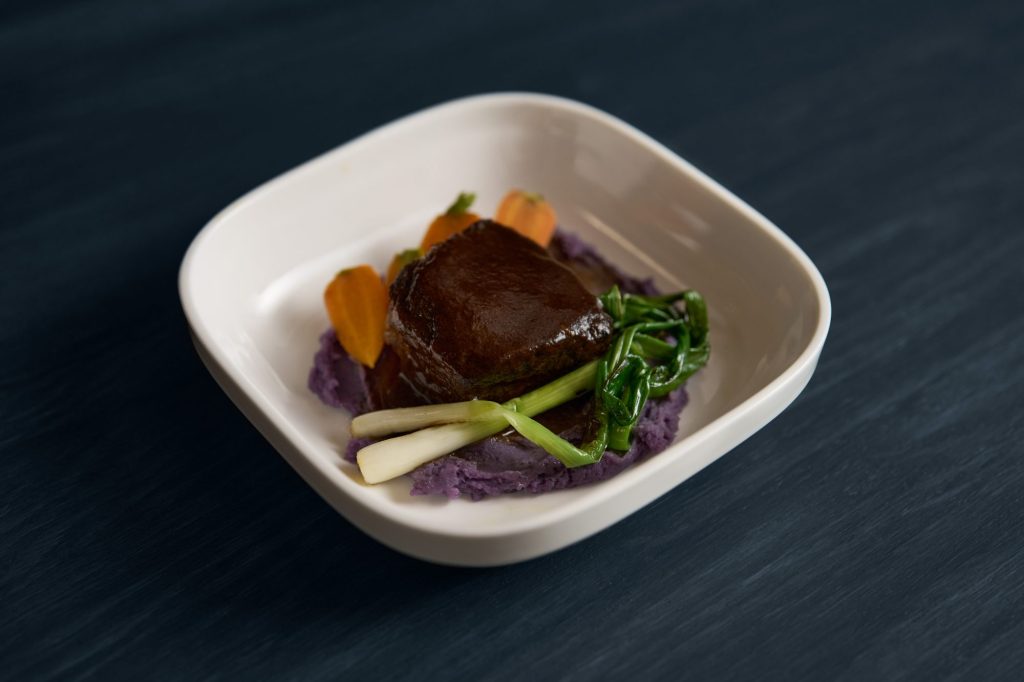Fariyal Abdullahi's Ethiopian-coffee glazed short ribs with purple mashed potatoes, carrots, and charred scallions.