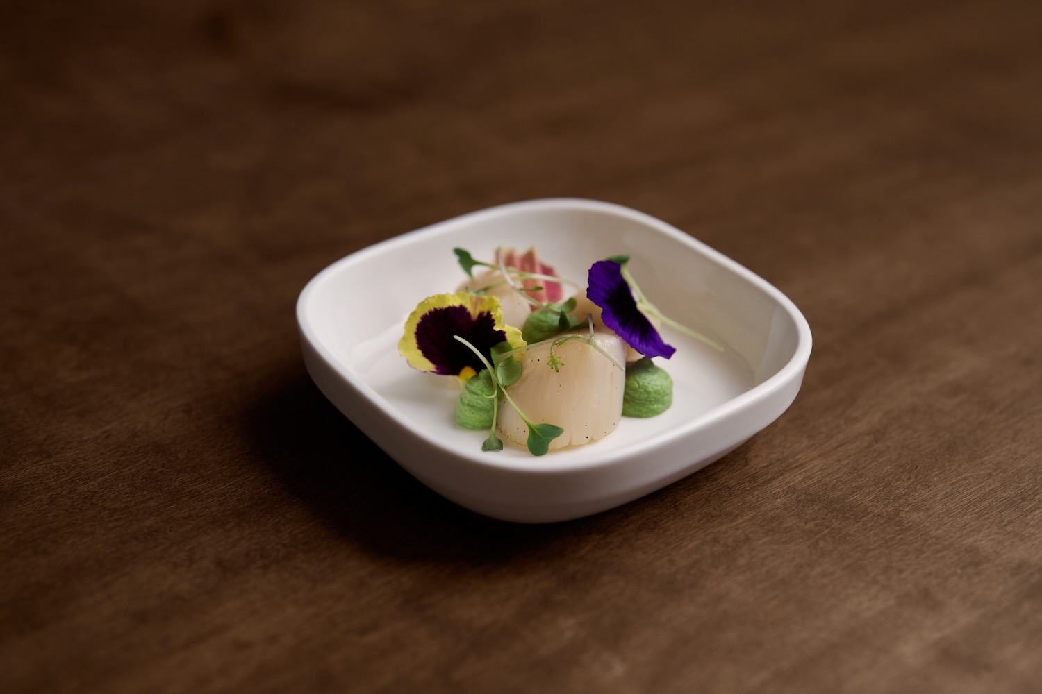 Tashi Gyamtso's poached scallop with yuzu-ginger glaze and edamame purée.