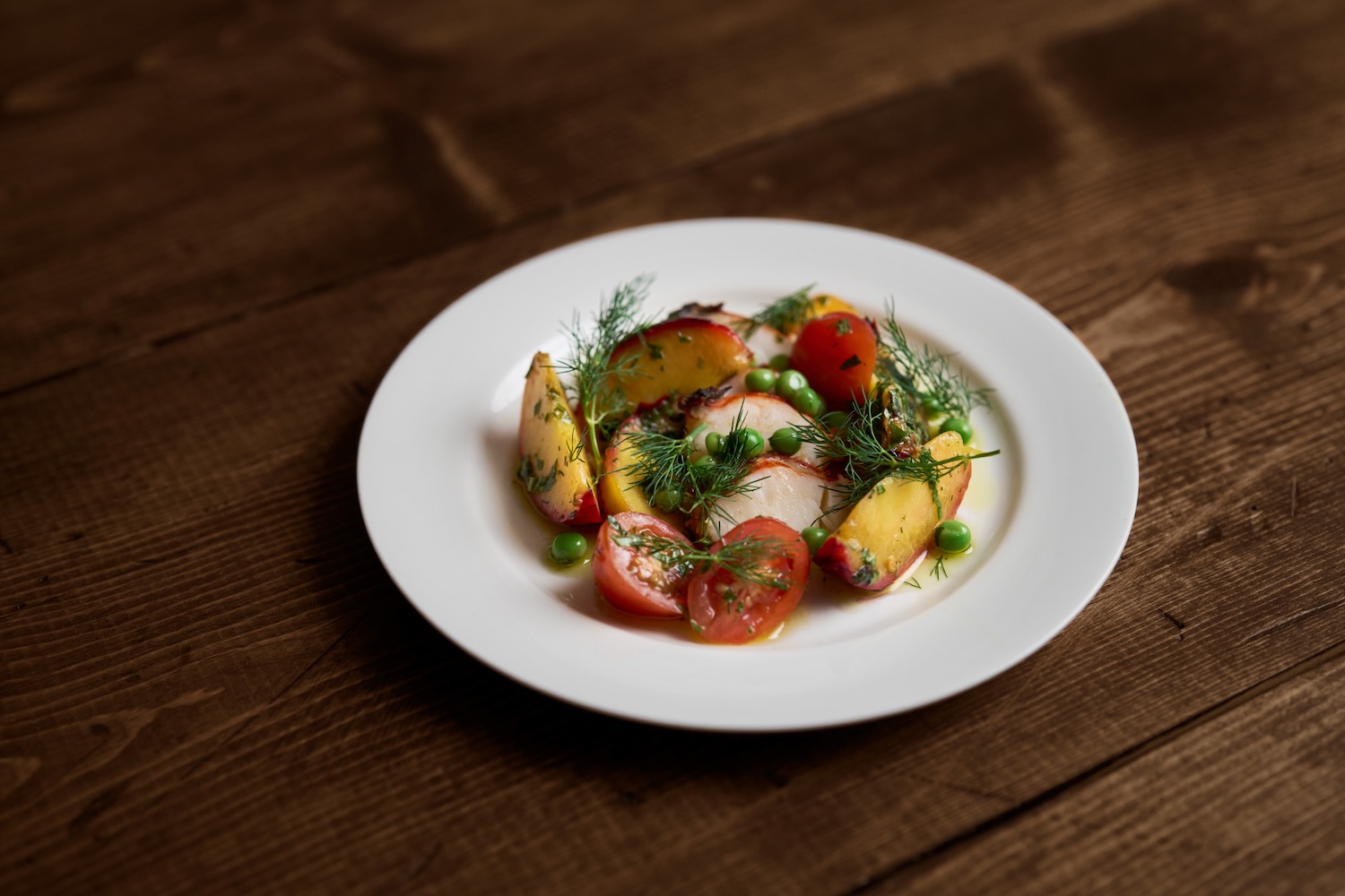 Tomos Parry's lobster with grilled peach, tomato, and fennel herb.