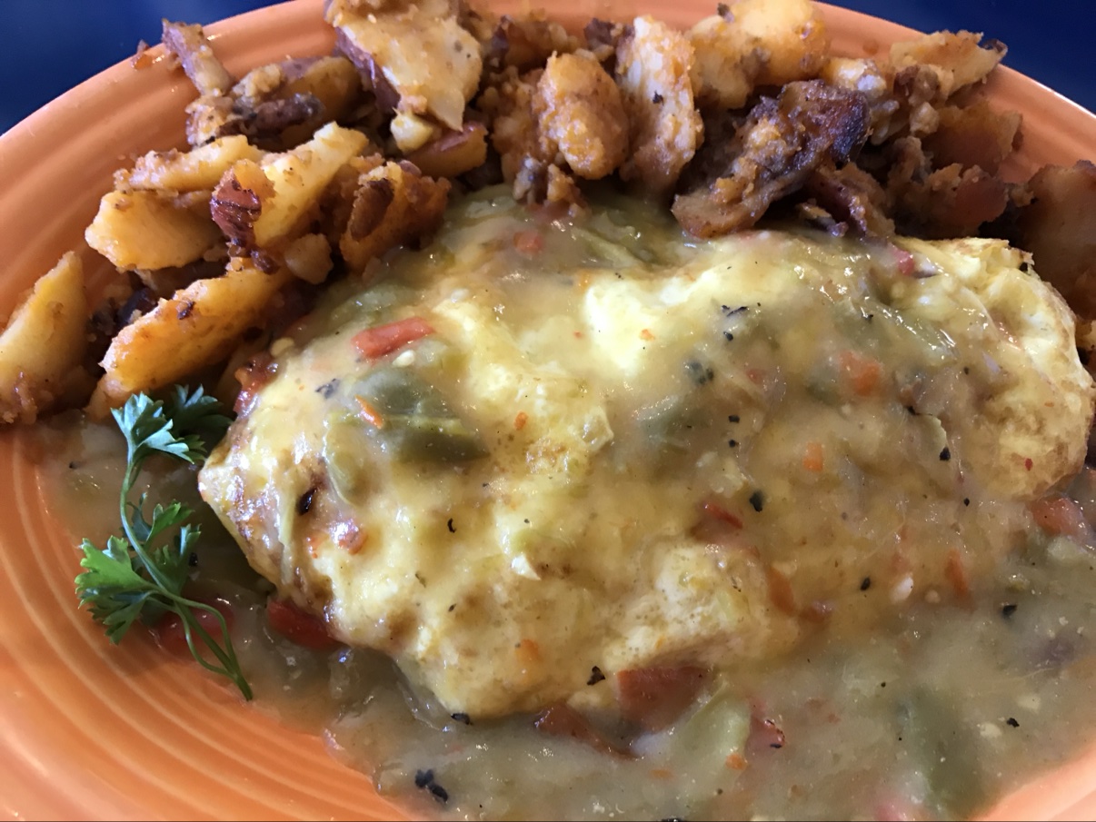 The chile relleno omelette at The Pantry in Santa Fe — smothered in green chile with crispy papas.