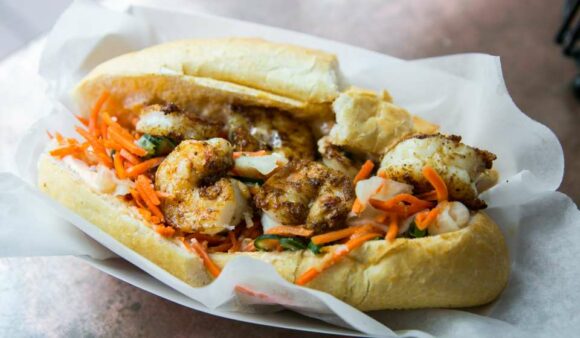 The Seared Gulf Shrimp po'boy at Killer Poboys with pickled carrots.