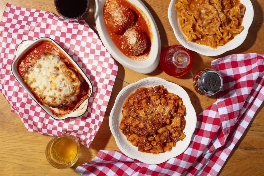 A red-sauce spread at Sunday Gravy: chicken parm, meatballs, and handmade pastas.