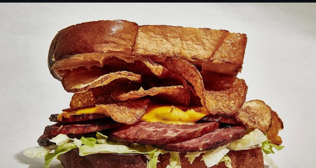 Turkey and the Wolf's fried bologna sandwich with potato chips