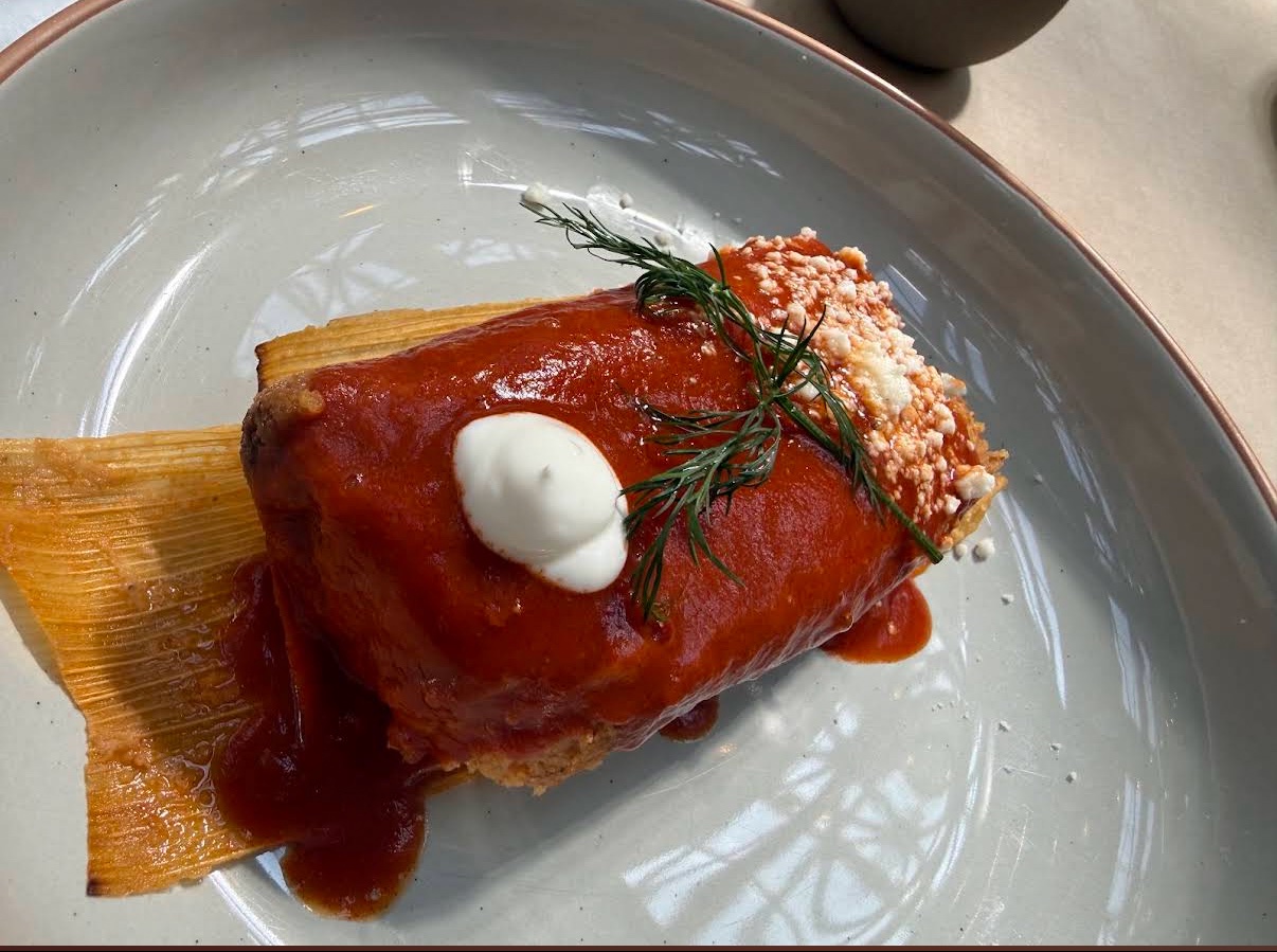 A red chile tamal with crema at Casa Tamalli 505