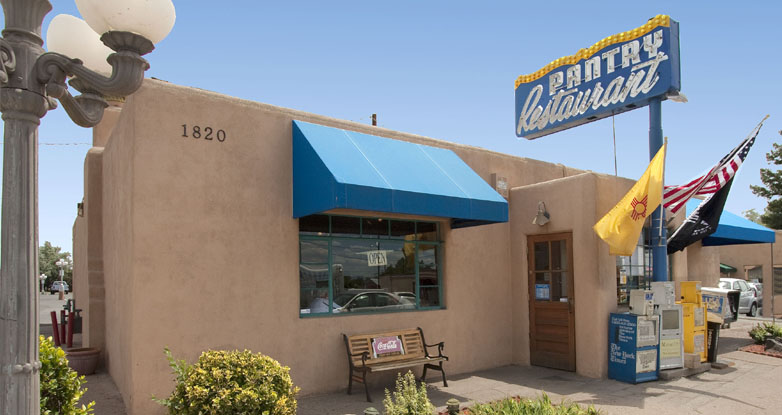 The Pantry's adobe exterior with its vintage neon sign on Cerrillos Road