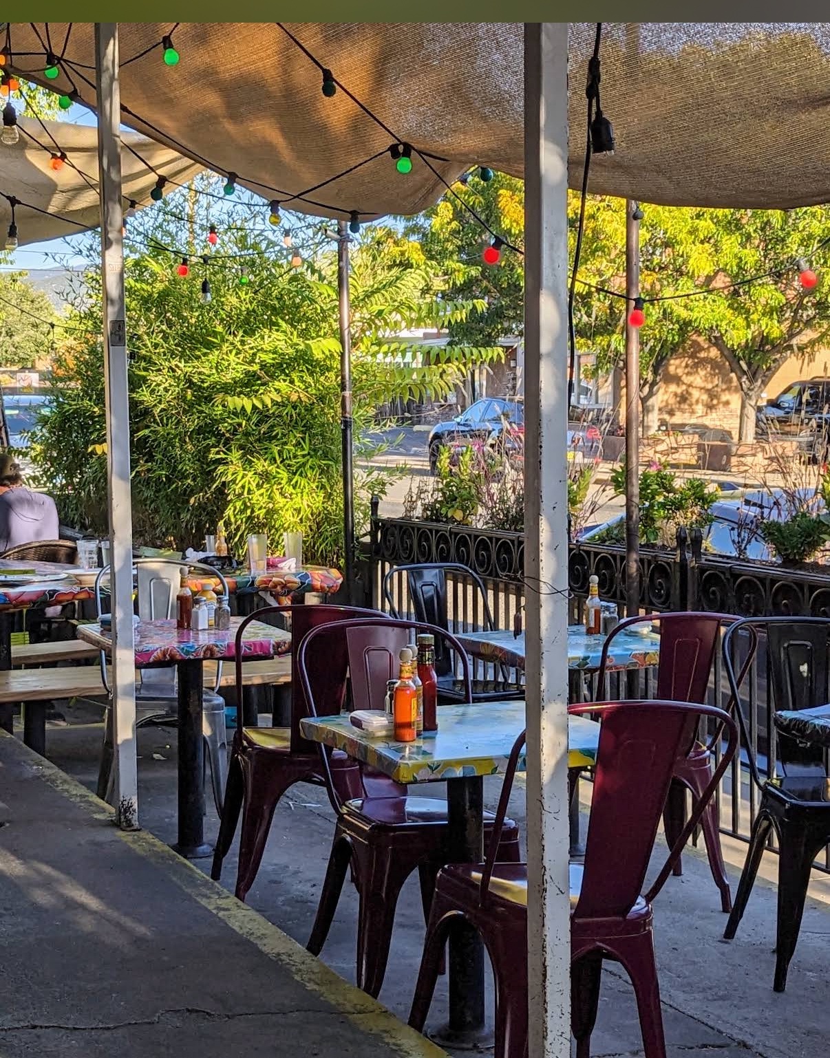 The shaded patio with string lights at Tune-Up Cafe in Santa Fe